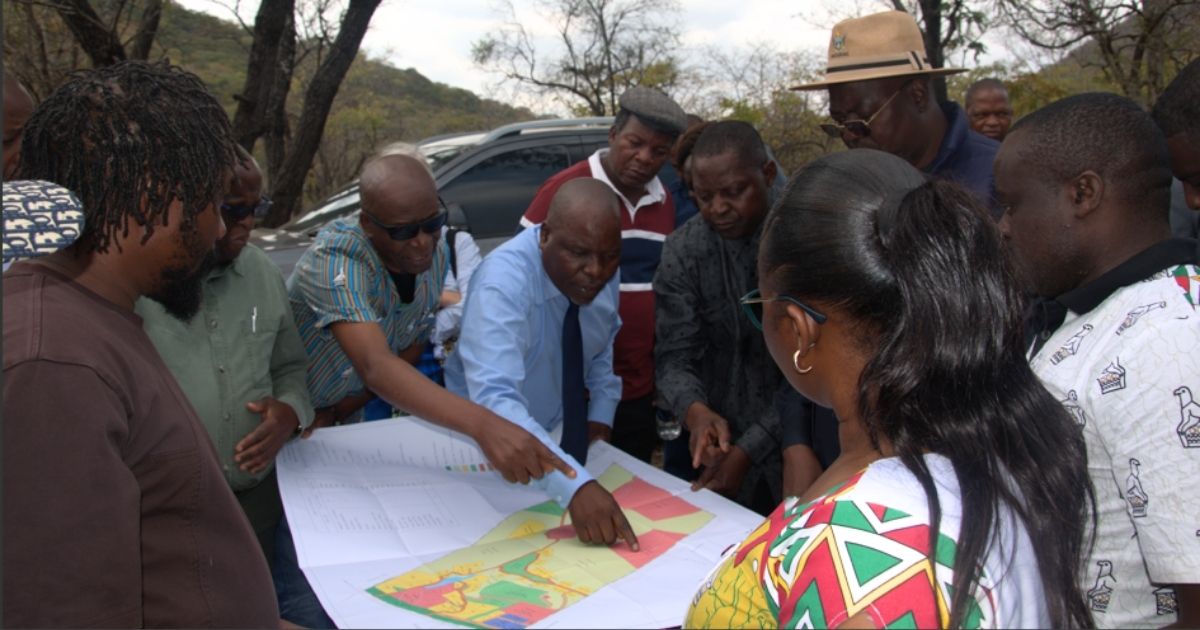 Stakeholders look at a map with the National Gallery of Zimbabwe to return to Mutare after a land gift