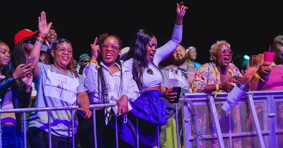 Music fans dancing in front of the stage at the 2025 edition of Jacaranda Music Festival 