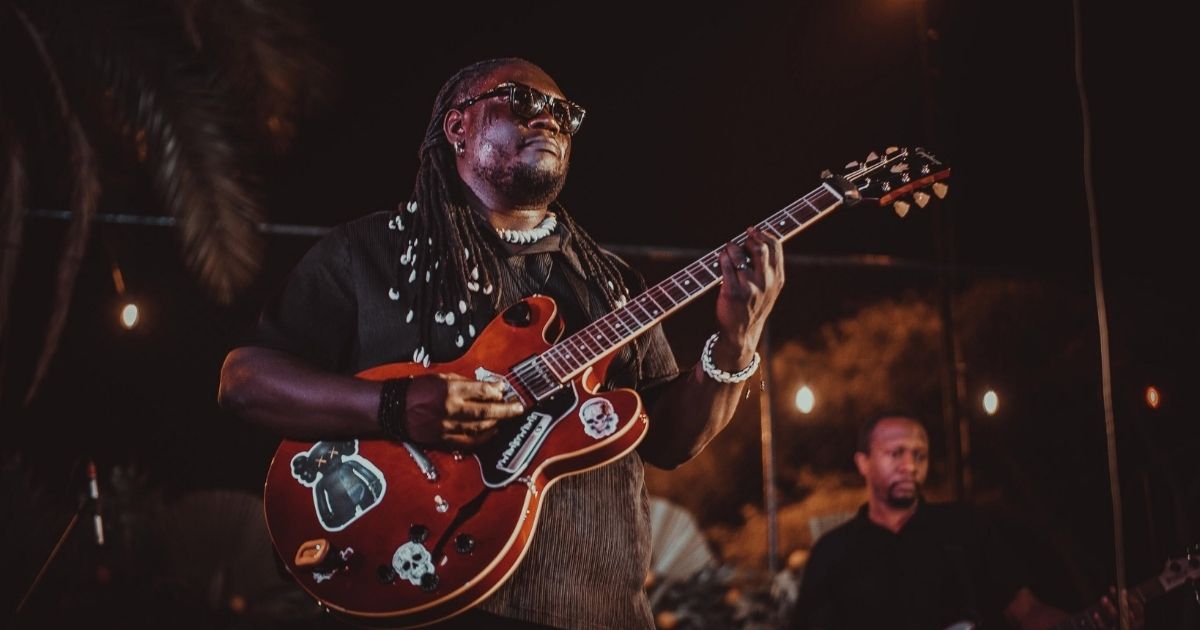 Sylent Nqo holding a guitar. The artist will be performing at the ACCES Industry Nights